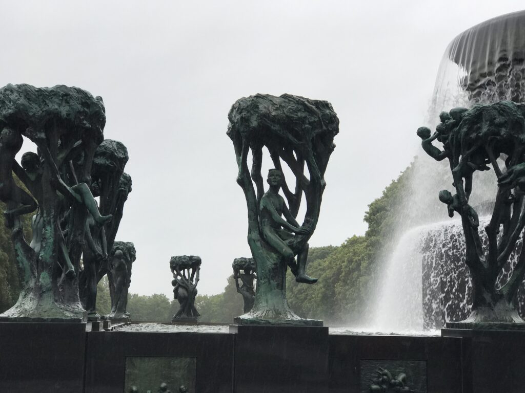 Fountain with human figures in tree like structures