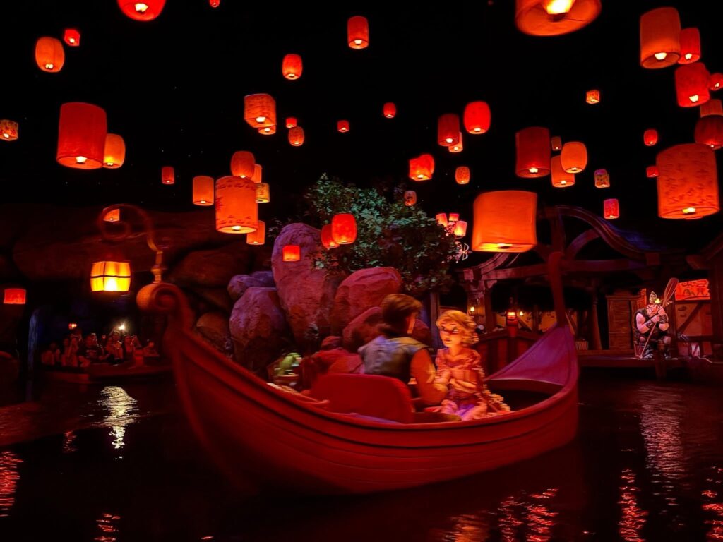 Tangled-themed boat ride at Tokyo DisneySea with glowing lanterns and Rapunzel scene