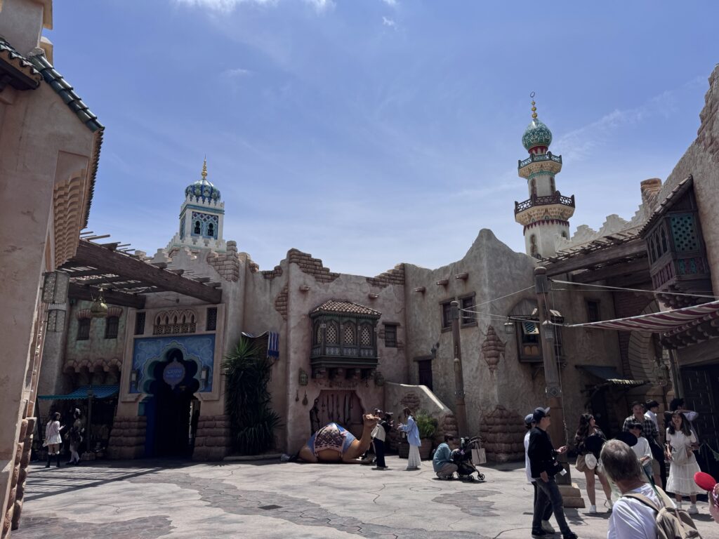 Courtyard in Tokyo DisneySea’s Arabian Coast with desert-style buildings and decorative towers