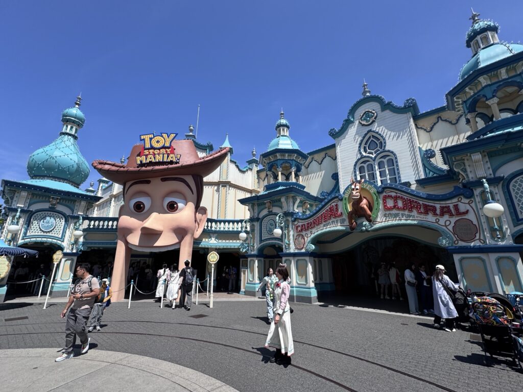 Toy Story Mania entrance at Tokyo DisneySea with Woody figure and colorful carnival-style facade