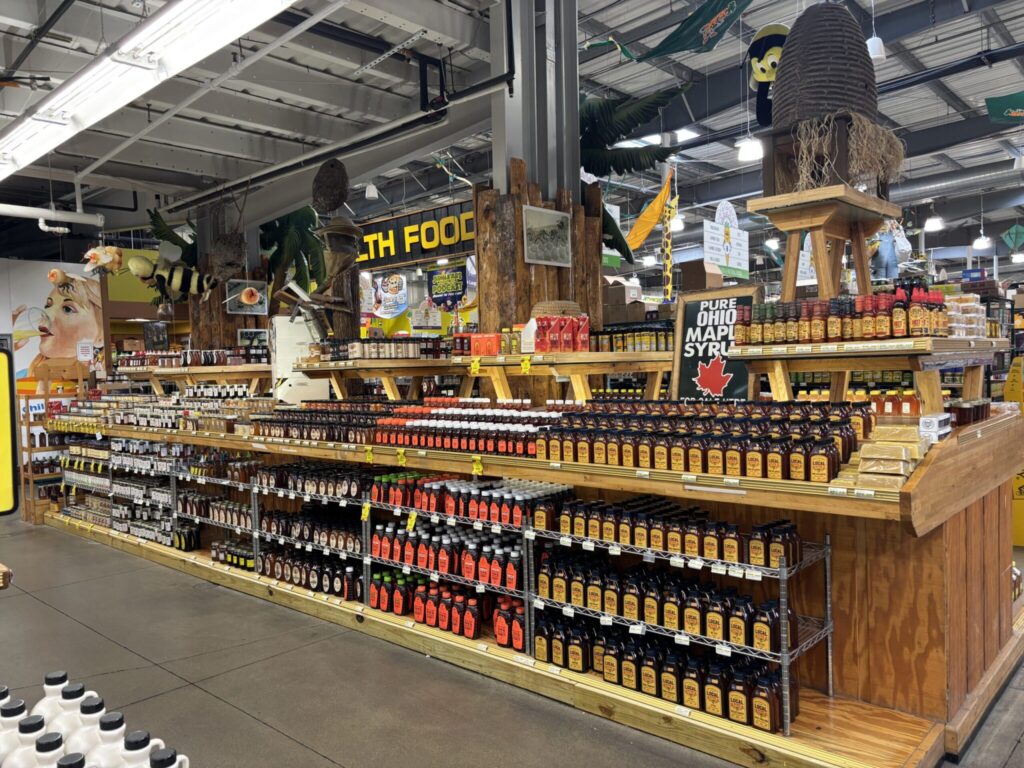 Honey display showing differnt local options for honey for sale at Jungle Jim's. 