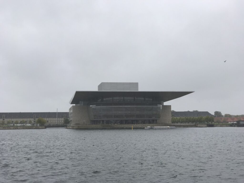 Copenhagen Opera House across the harbor under overcast skies