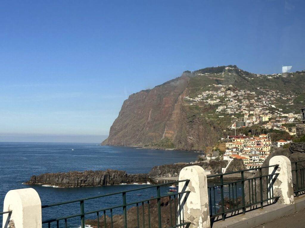Coastal cliffs and hillside homes in Madeira overlooking the Atlantic Ocean near Funchal