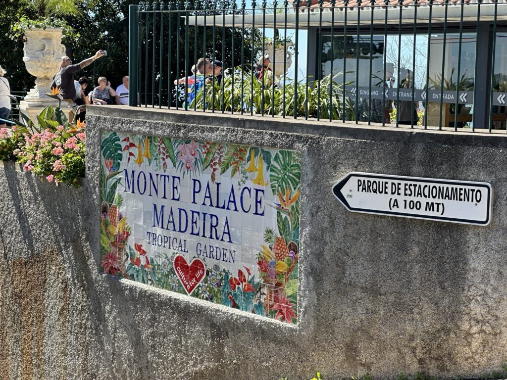 Monte Palace Tropical Garden sign in Madeira near entrance to Monte area