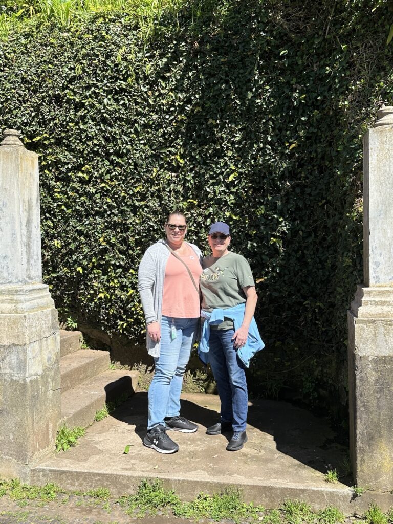 Visitors standing near Monte gardens in Madeira before toboggan ride experience